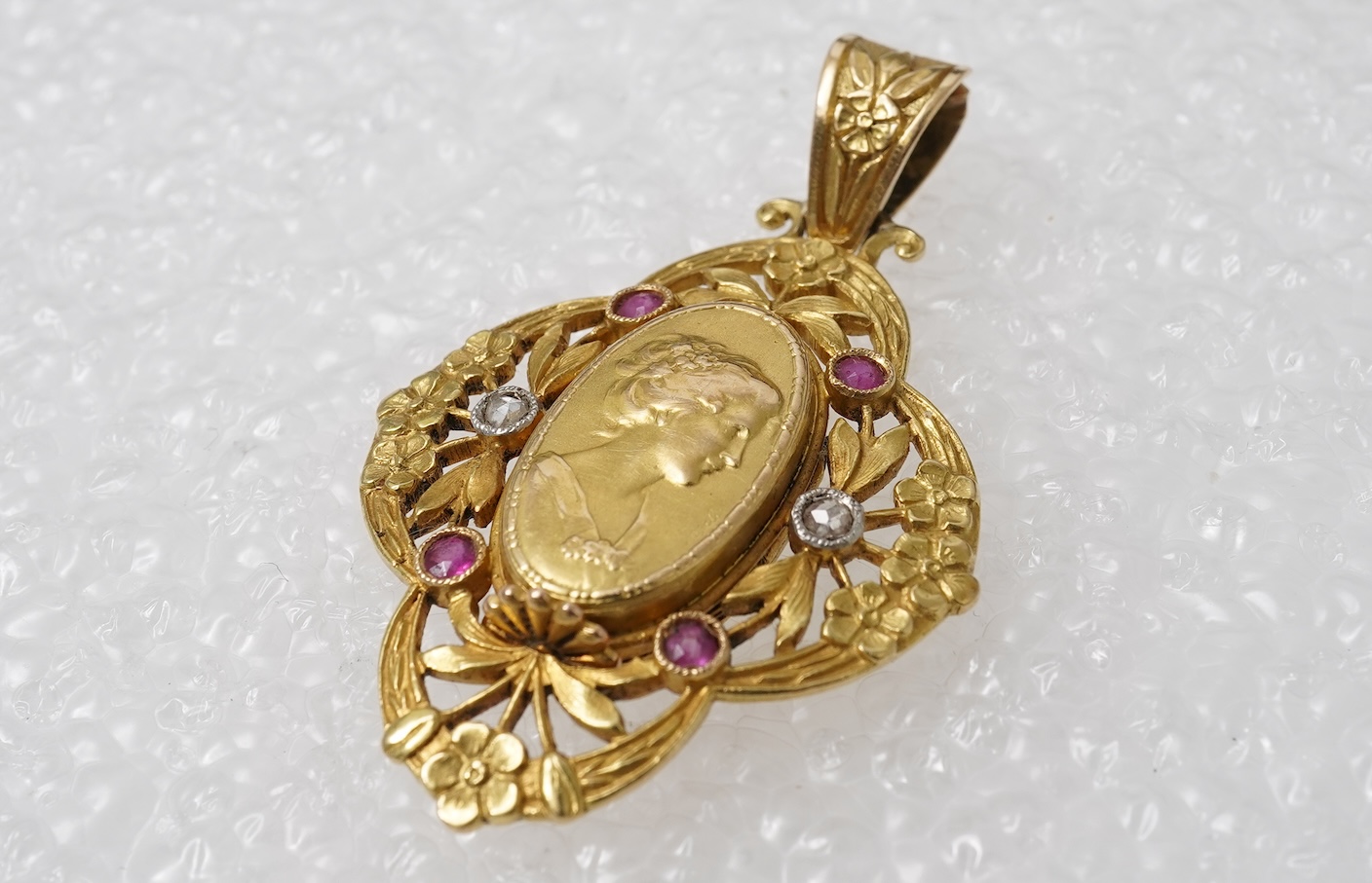 An Art Nouveau ruby and diamond locket pendant, France, circa 1900